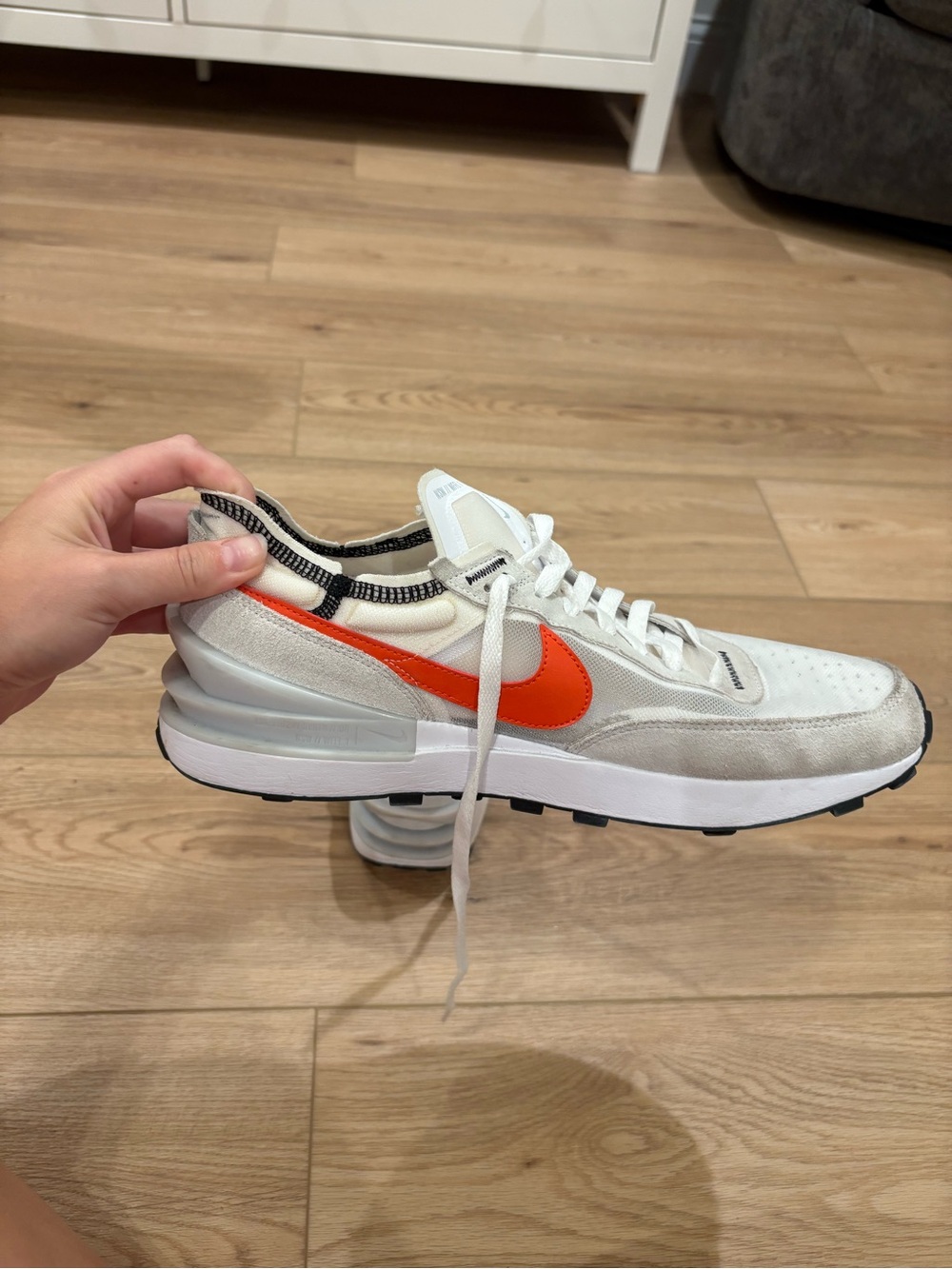Nike Men’s White Sneaker with Orange Swoosh and Gray Accents